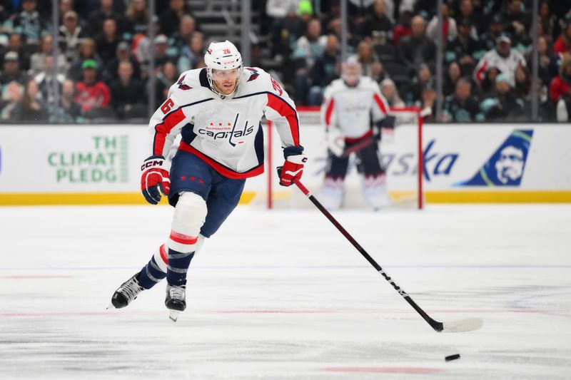 Mar 14, 2024; Seattle, Washington, USA; Washington Capitals right wing Nic Dowd (26) advances the puck against the Seattle Kraken during the first period at Climate Pledge Arena. Mandatory Credit: Steven Bisig-USA TODAY Sports