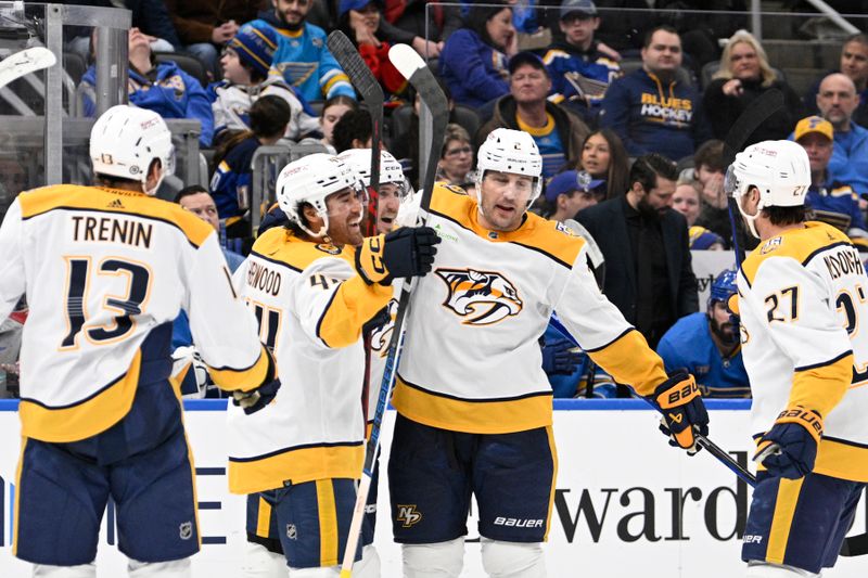 Feb 17, 2024; St. Louis, Missouri, USA; Nashville Predators defenseman Luke Schenn (2) is congratulated by teammates after scoring a goal against the St. Louis Blues during the third period at Enterprise Center. Mandatory Credit: Jeff Le-USA TODAY Sports