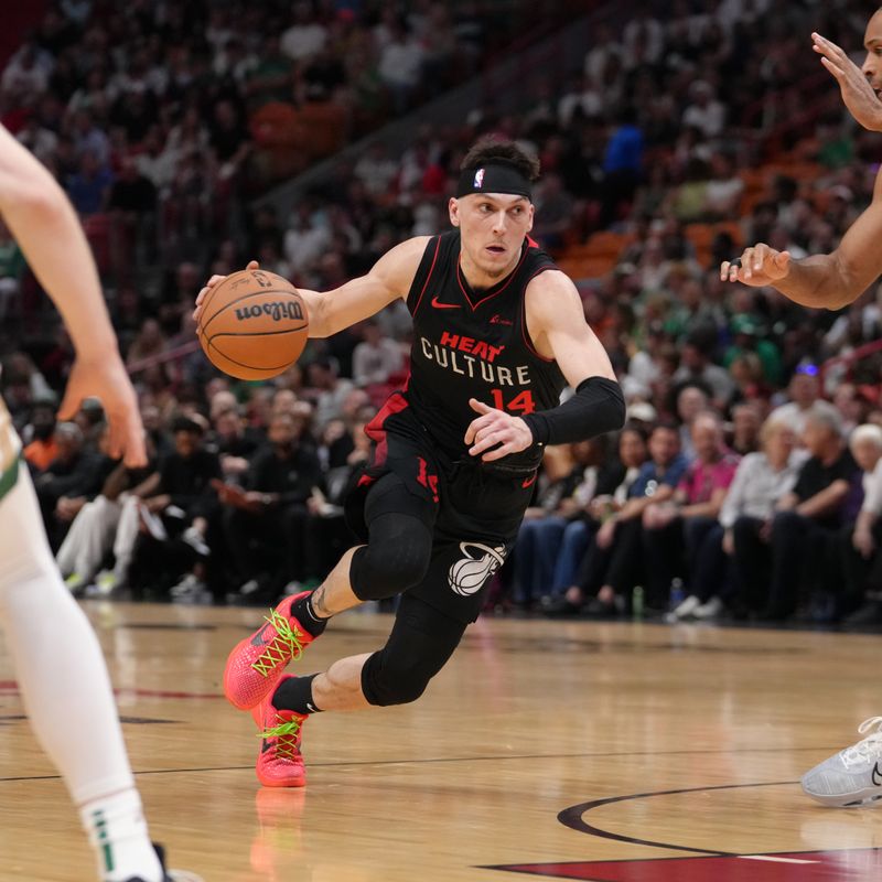 MIAMI, FL - FEBRUARY 11: Tyler Herro #14 of the Miami Heat dribbles the ball during the game against the Boston Celtics on February 11, 2024 at Kaseya Center in Miami, Florida. NOTE TO USER: User expressly acknowledges and agrees that, by downloading and or using this Photograph, user is consenting to the terms and conditions of the Getty Images License Agreement. Mandatory Copyright Notice: Copyright 2024 NBAE (Photo by Eric Espada/NBAE via Getty Images)