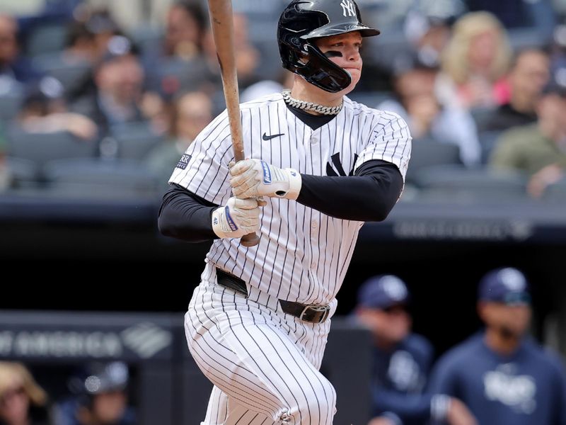 Apr 21, 2024; Bronx, New York, USA; New York Yankees left fielder Alex Verdugo (24) follows through on a two run single against the Tampa Bay Rays during the fifth inning at Yankee Stadium. Mandatory Credit: Brad Penner-USA TODAY Sports