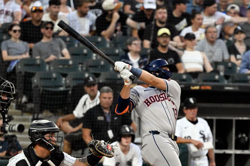Jun 19, 2024; Chicago, Illinois, USA;  Houston Astros catcher César Salazar (18) hits an RBI single against the Chicago White Sox during the fourth inning at Guaranteed Rate Field. Mandatory Credit: Matt Marton-USA TODAY Sports