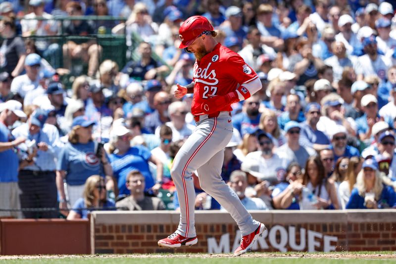 Jun 2, 2024; Chicago, Illinois, USA; Cincinnati Reds outfielder Jake Fraley (27) scores against the Chicago Cubs during the second inning at Wrigley Field. Mandatory Credit: Kamil Krzaczynski-USA TODAY Sports