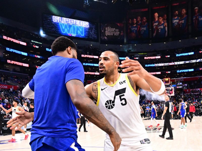 LOS ANGELES, CA - APRIL 5:  Paul George #13 of the LA Clippers & Talen Horton-Tucker #5 of the Utah Jazz embrace after the game on April 5, 2024 at Crypto.Com Arena in Los Angeles, California. NOTE TO USER: User expressly acknowledges and agrees that, by downloading and/or using this Photograph, user is consenting to the terms and conditions of the Getty Images License Agreement. Mandatory Copyright Notice: Copyright 2024 NBAE (Photo by Adam Pantozzi/NBAE via Getty Images)