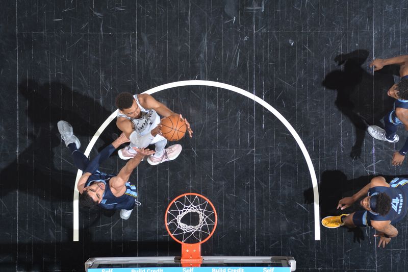 SAN ANTONIO, TX - MARCH 22  Victor Wembanyama #1 of the San Antonio Spurs drives to the basket during the game against the Memphis Grizzlies on March 22, 2024 at the Frost Bank Center in San Antonio, Texas. NOTE TO USER: User expressly acknowledges and agrees that, by downloading and or using this photograph, user is consenting to the terms and conditions of the Getty Images License Agreement. Mandatory Copyright Notice: Copyright 2024 NBAE (Photos by Michael Gonzales/NBAE via Getty Images)