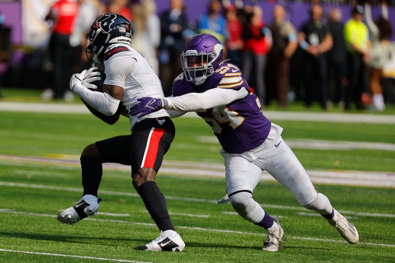 Minnesota Vikings linebacker Kamu Grugier-Hill (54) tackles Houston Texans wide receiver Stefon Diggs during the second half of an NFL football game, Sunday, Sept. 22, 2024, in Minneapolis. (AP Photo/Bruce Kluckhohn)