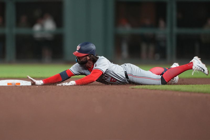 Apr 9, 2024; San Francisco, California, USA; Washington Nationals left fielder Jesse Winker (6) slides into second base for a double against the San Francisco Giants during the ninth inning at Oracle Park. Mandatory Credit: Darren Yamashita-USA TODAY Sports