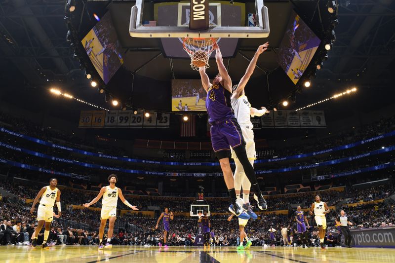 LOS ANGELES, CA - NOVEMBER 19: Dalton Knecht #4 of the Los Angeles Lakers dunks the ball during the game against the Utah Jazz during the Emirates NBA Cup game on November 19, 2024 at Crypto.Com Arena in Los Angeles, California. NOTE TO USER: User expressly acknowledges and agrees that, by downloading and/or using this Photograph, user is consenting to the terms and conditions of the Getty Images License Agreement. Mandatory Copyright Notice: Copyright 2024 NBAE (Photo by Adam Pantozzi/NBAE via Getty Images)