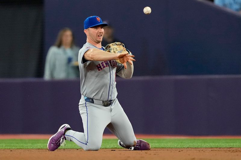 Sep 9, 2024; Toronto, Ontario, CAN; New York Mets first baseman Pete Alonso (20) throws out Toronto Blue Jays left fielder Nathan Lukes (not pictured) at first base during the second inning at Rogers Centre. Mandatory Credit: John E. Sokolowski-Imagn Images