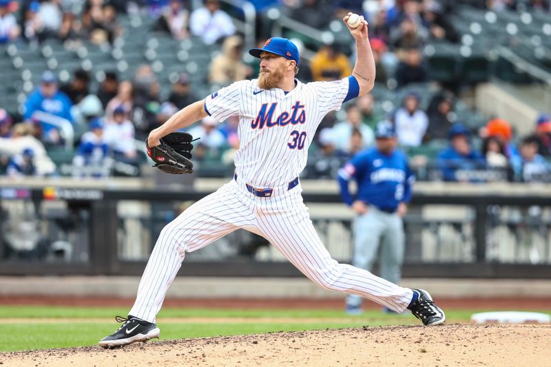 Apr 13, 2024; New York City, New York, USA;  New York Mets relief pitcher Jake Diekman (30) pitches in the seventh inning against the Kansas City Royals at Citi Field. Mandatory Credit: Wendell Cruz-USA TODAY Sports