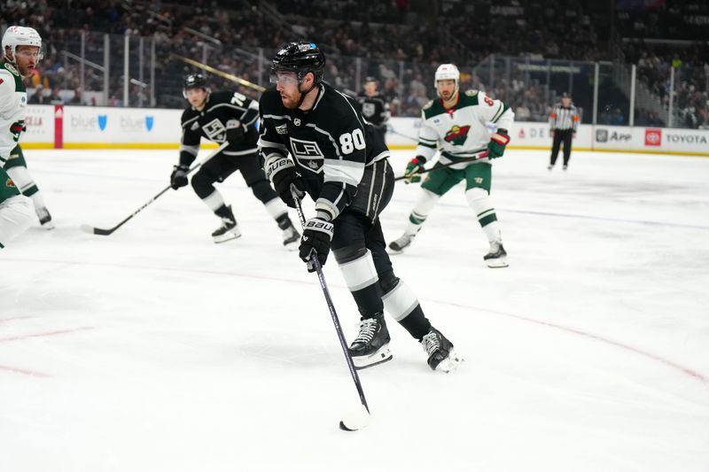 Apr 15, 2024; Los Angeles, California, USA; LA Kings center Pierre-Luc Dubois (80) skates with the puck against the Minnesota Wild in the second period at Crypto.com Arena. Mandatory Credit: Kirby Lee-USA TODAY Sports