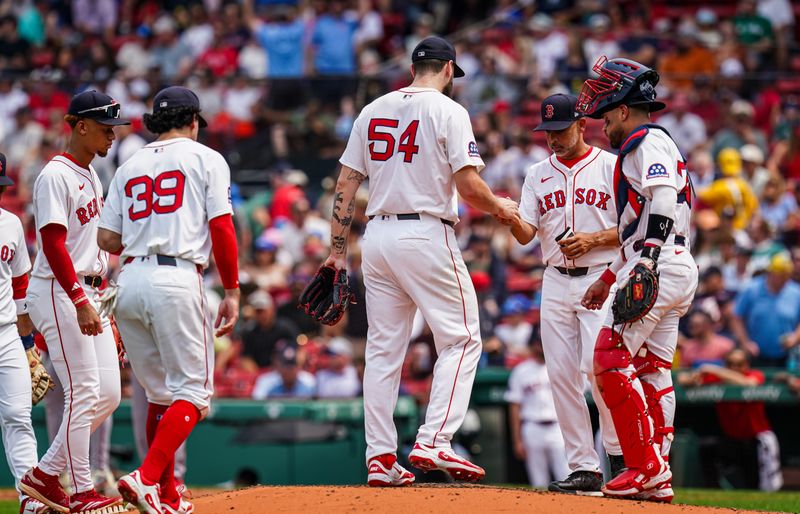 Jun 4, 2025; Boston, Massachusetts, USA; Boston Red Sox manager Alex Cora (13) relieves pitcher Lucas Giolito (54) as they take on the Los Angeles Angels in the second inning at Fenway Park. Mandatory Credit: David Butler II-Imagn Images