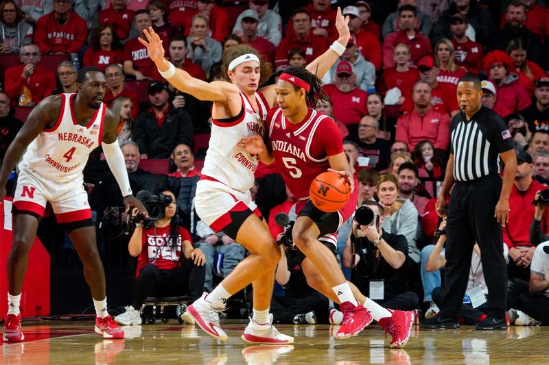 Jan 3, 2024; Lincoln, Nebraska, USA; Indiana Hoosiers forward Malik Reneau (5) drives against Nebraska Cornhuskers forward Josiah Allick (53) during the first half at Pinnacle Bank Arena. Mandatory Credit: Dylan Widger-USA TODAY Sports