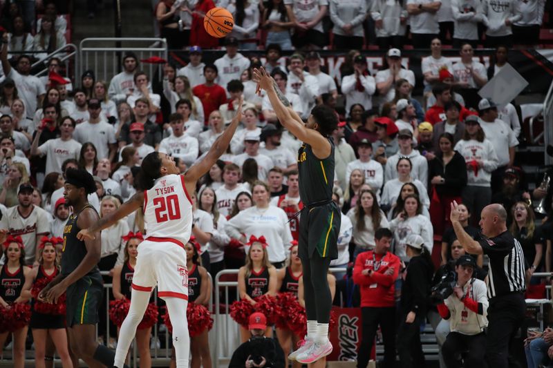 Jan 17, 2023; Lubbock, Texas, USA;  Baylor Bears guard Keyonte George (1) takes a jump shot over Texas Tech Red Raiders guard Jaylon Tyson (20) in the second half at United Supermarkets Arena. Mandatory Credit: Michael C. Johnson-USA TODAY Sports