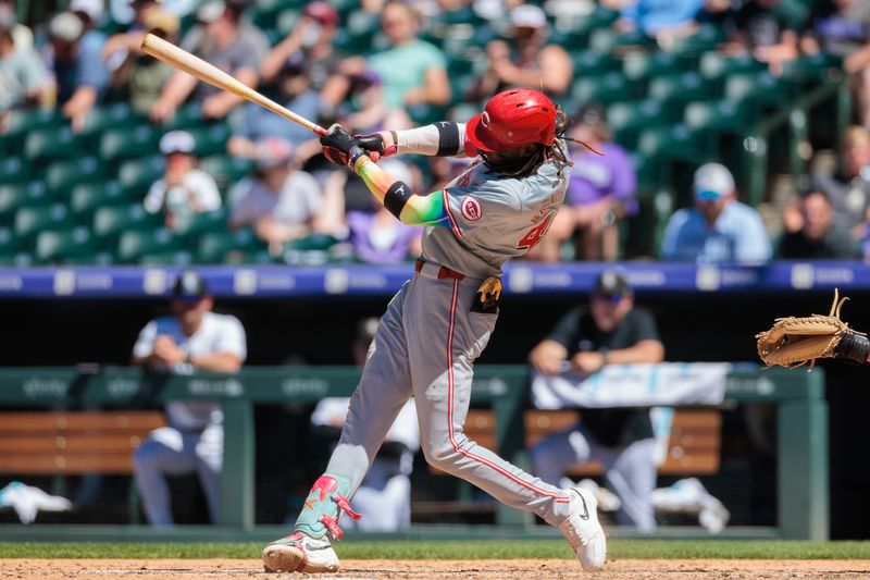 Jun 5, 2024; Denver, Colorado, USA; Cincinnati Reds shortstop Elly De La Cruz (44) hits an RBI single during the seventh inning against the Colorado Rockies at Coors Field. Mandatory Credit: Andrew Wevers-USA TODAY Sports