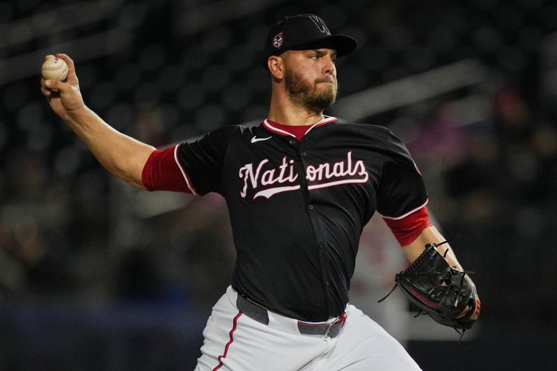 Mar 8, 2024; West Palm Beach, Florida, USA:  Washington Nationals relief pitcher Tanner Rainey (21) pitches in the fourth inning against the St. Louis Cardinals at CACTI Park of the Palm Beaches. Mandatory Credit: Jim Rassol-USA TODAY Sports