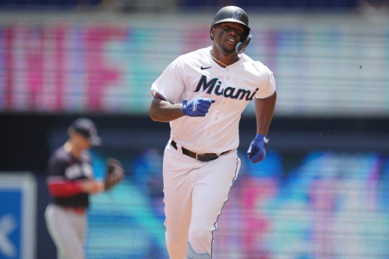 Apr 5, 2023; Miami, Florida, USA;  Miami Marlins left fielder Jorge Soler (12) rounds the bases after hitting a home run against the Minnesota Twins in the first inning at loanDepot Park. Mandatory Credit: Jim Rassol-USA TODAY Sports