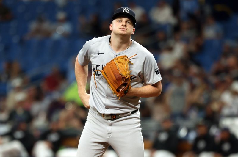 May 10, 2024; St. Petersburg, Florida, USA; New York Yankees pitcher Clarke Schmidt (36) looks on while on the mound against the Tampa Bay Rays during the first inning  at Tropicana Field. Mandatory Credit: Kim Klement Neitzel-USA TODAY Sports