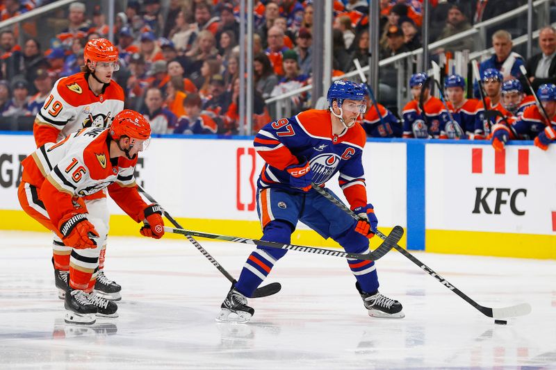 Jan 3, 2025; Edmonton, Alberta, CAN; Edmonton Oilers forward Connor McDavid (97) looks to make a pass against Anaheim Ducks forward Ryan Strome (16) during the third period at Rogers Place. Mandatory Credit: Perry Nelson-Imagn Images