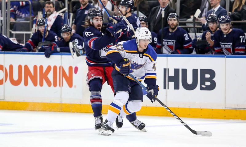 Mar 9, 2024; New York, New York, USA; New York Rangers center Mika Zibanejad (93) and St. Louis Blues defenseman Torey Krug (47) get tangled up during the second period at Madison Square Garden. Mandatory Credit: Danny Wild-USA TODAY Sports