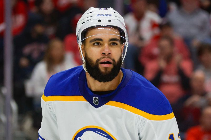 Nov 2, 2024; Detroit, Michigan, USA; Buffalo Sabres left wing Jordan Greenway (12) looks on during the second period of the game against the Detroit Red Wings at Little Caesars Arena. Mandatory Credit: Brian Bradshaw Sevald-Imagn Images