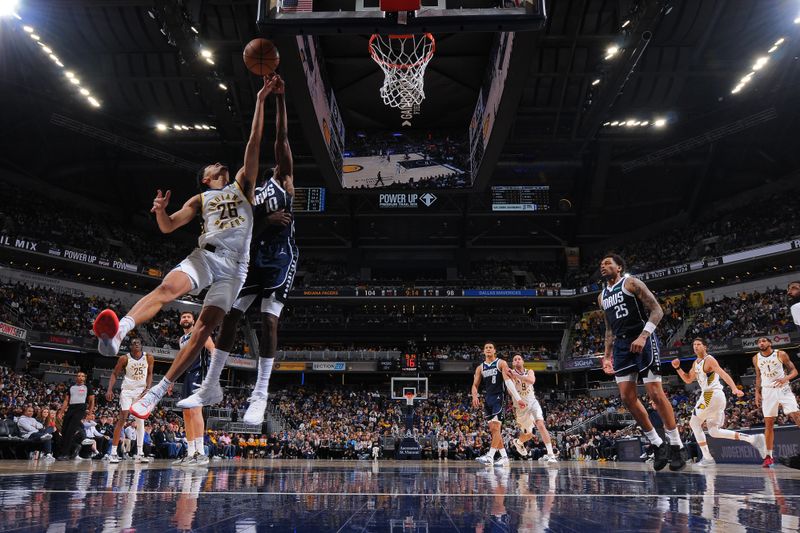 INDIANAPOLIS, IN - FEBRUARY 25: Ben Sheppard #26 of the Indiana Pacers  grabs a rebound during the game against the Dallas Mavericks on February 25, 2024 at Gainbridge Fieldhouse in Indianapolis, Indiana. NOTE TO USER: User expressly acknowledges and agrees that, by downloading and or using this Photograph, user is consenting to the terms and conditions of the Getty Images License Agreement. Mandatory Copyright Notice: Copyright 2024 NBAE (Photo by Ron Hoskins/NBAE via Getty Images)