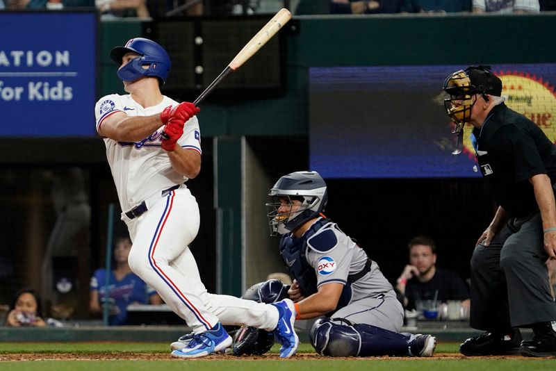 Apr 6, 2024; Arlington, Texas, USA; Texas Rangers outfielder Wyatt Langford (36) follows through on an RBI double during the eighth inning against the Houston Astros at Globe Life Field. Mandatory Credit: Raymond Carlin III-USA TODAY Sports