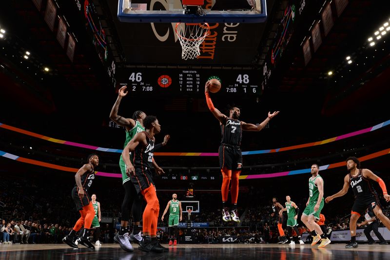 DETROIT, MI - MARCH 22: Troy Brown Jr. #7 of the Detroit Pistons rebounds the ball during the game against the Boston Celtics on March 22, 2024 at Little Caesars Arena in Detroit, Michigan. NOTE TO USER: User expressly acknowledges and agrees that, by downloading and/or using this photograph, User is consenting to the terms and conditions of the Getty Images License Agreement. Mandatory Copyright Notice: Copyright 2024 NBAE (Photo by Chris Schwegler/NBAE via Getty Images)