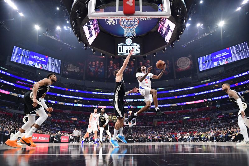 LOS ANGELES, CA - MARCH 10: Bones Hyland #5 of the LA Clippers shoots the ball during the game against the Milwaukee Bucks on March 10, 2024 at Crypto.Com Arena in Los Angeles, California. NOTE TO USER: User expressly acknowledges and agrees that, by downloading and/or using this Photograph, user is consenting to the terms and conditions of the Getty Images License Agreement. Mandatory Copyright Notice: Copyright 2024 NBAE (Photo by Adam Pantozzi/NBAE via Getty Images)