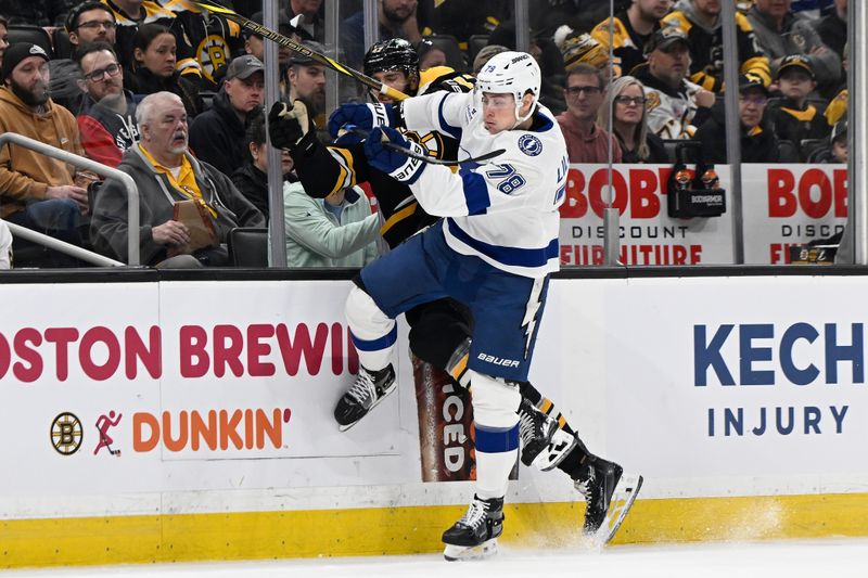 Mar 15, 2025; Boston, Massachusetts, USA; Tampa Bay Lightning defenseman Emil Lilleberg (78) checks Boston Bruins center Mark Kastelic (47) into the boards during the first period at TD Garden. Mandatory Credit: Eric Canha-Imagn Images