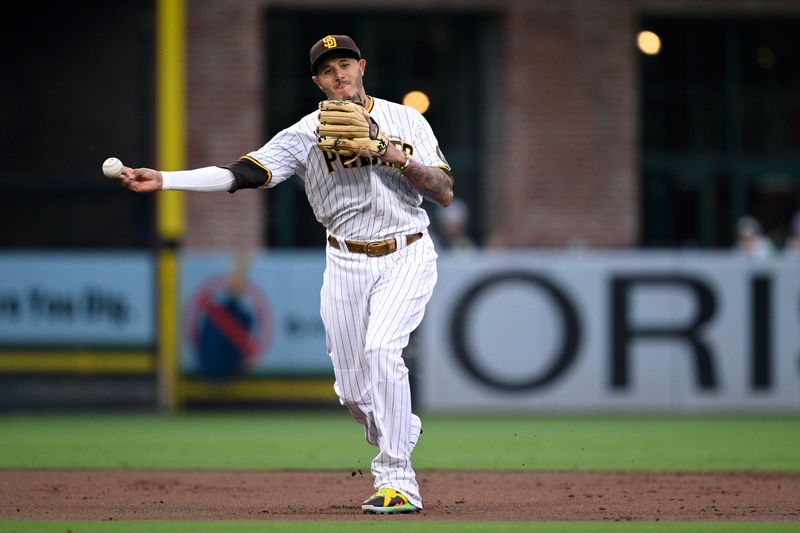 Aug 14, 2023; San Diego, California, USA; San Diego Padres third baseman Manny Machado (13) throws to first base on a ground out by Baltimore Orioles center fielder Aaron Hicks (not pictured) during the third inning at Petco Park. Mandatory Credit: Orlando Ramirez-USA TODAY Sports