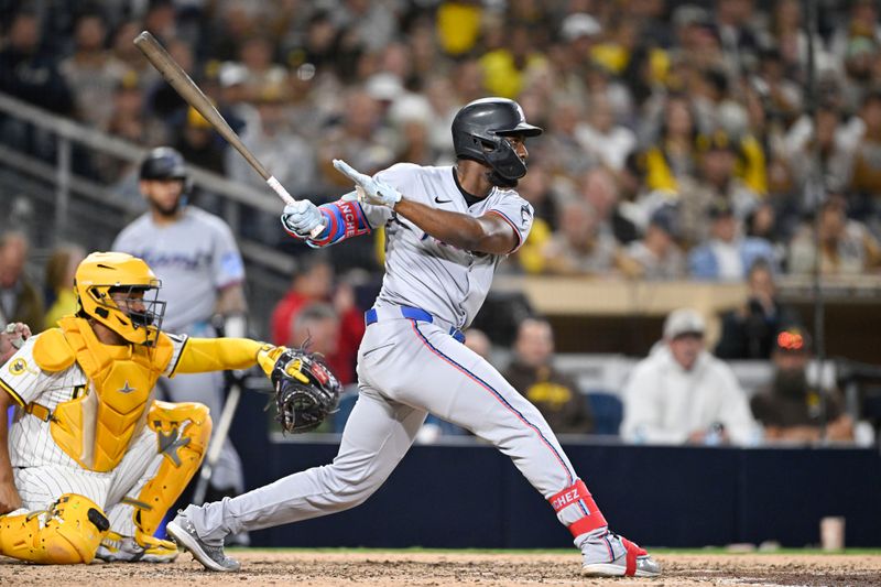 May 27, 2025; San Diego, California, USA; Miami Marlins outfielder Jesús Sánchez (7) hits a single during the seventh inning against the San Diego Padres at Petco Park. Mandatory Credit: Denis Poroy-Imagn Images