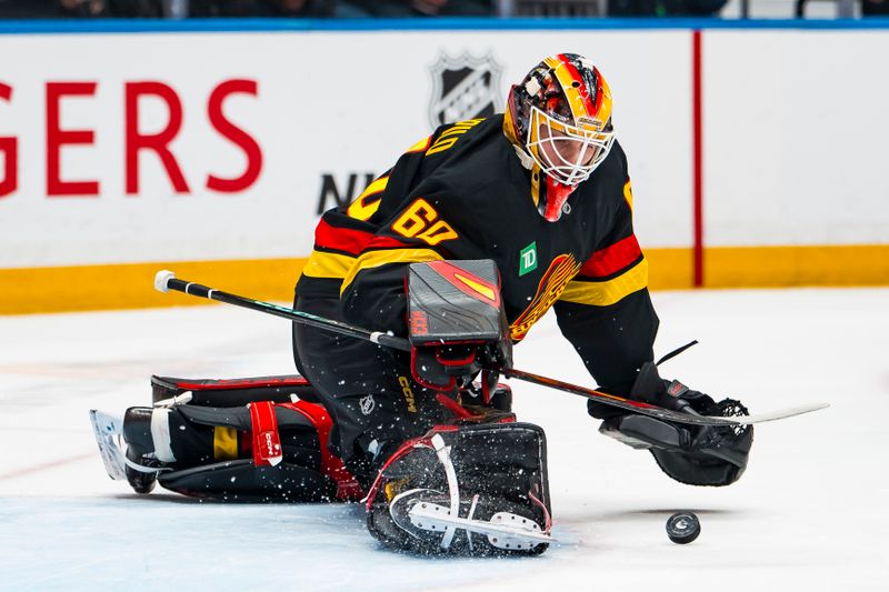 Mar 2, 2026; Vancouver, British Columbia, CAN; Vancouver Canucks goalie Nikita Tolopilo (60) makes a save against the Dallas Stars in the third period at Rogers Arena. Mandatory Credit: Bob Frid-Imagn Images