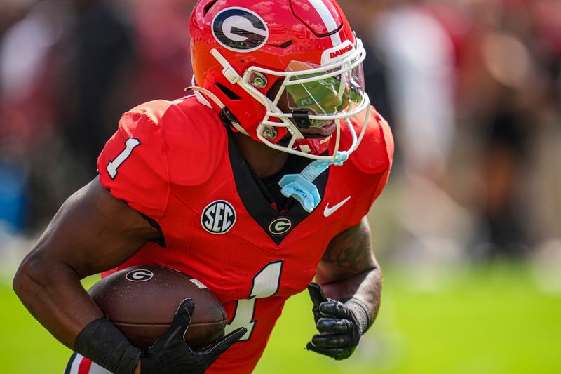 Oct 5, 2024; Athens, Georgia, USA; Georgia Bulldogs running back Trevor Etienne (1) on the field during pregame warmups before the game against the Auburn Tigers at Sanford Stadium. Mandatory Credit: Dale Zanine-Imagn Images