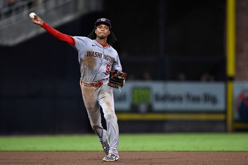 Jun 24, 2024; San Diego, California, USA; Washington Nationals shortstop CJ Abrams (5) throws to first base during the ninth inning against the San Diego Padres at Petco Park. Mandatory Credit: Orlando Ramirez-USA TODAY Sports