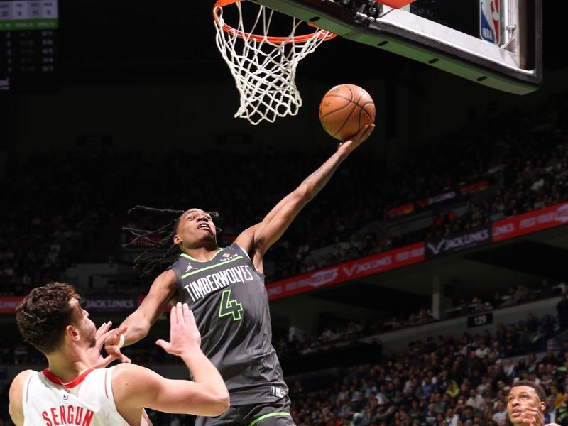 MINNEAPOLIS, MN -  NOVEMBER 26: Rob Dillingham #4 of the Minnesota Timberwolves drives to the basket during the game against the Houston Rockets during the Emirates NBA Cup game on November 26, 2024 at Target Center in Minneapolis, Minnesota. NOTE TO USER: User expressly acknowledges and agrees that, by downloading and or using this Photograph, user is consenting to the terms and conditions of the Getty Images License Agreement. Mandatory Copyright Notice: Copyright 2024 NBAE (Photo by David Sherman/NBAE via Getty Images)