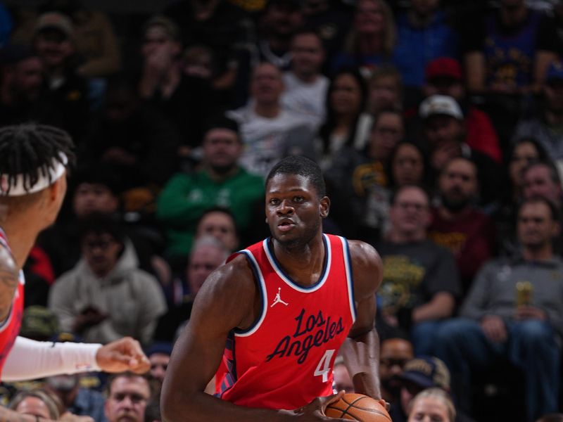 DENVER, CO - DECEMBER 13: Mo Bamba #4 of the LA Clippers handles the ball during the game against the Denver Nuggets on December 13, 2024 at Ball Arena in Denver, Colorado. NOTE TO USER: User expressly acknowledges and agrees that, by downloading and/or using this Photograph, user is consenting to the terms and conditions of the Getty Images License Agreement. Mandatory Copyright Notice: Copyright 2024 NBAE (Photo by Garrett Ellwood/NBAE via Getty Images)