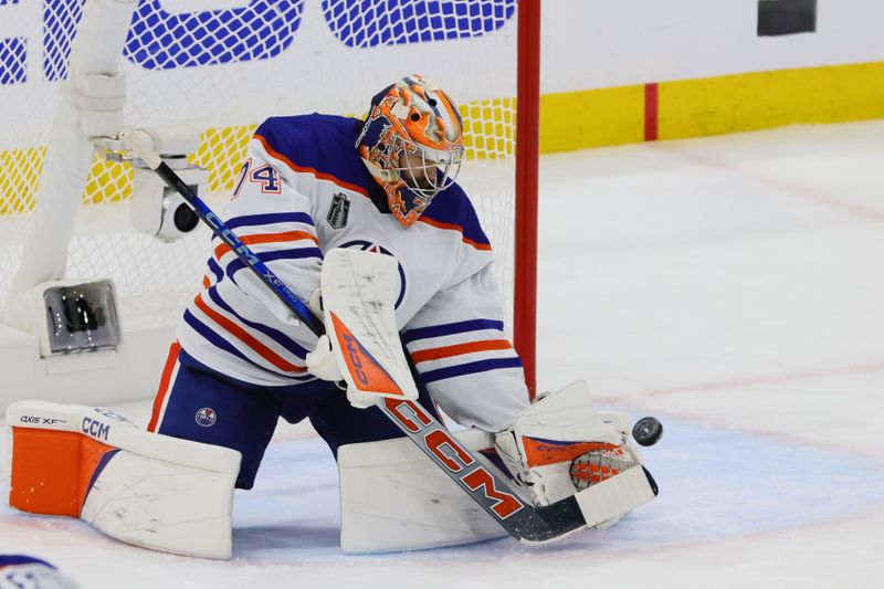Jun 10, 2024; Sunrise, Florida, USA; Edmonton Oilers goaltender Skinner Stuart (74) blocks a shot on net during the first period against the Florida Panthers in game two of the 2024 Stanley Cup Final at Amerant Bank Arena. Mandatory Credit: Sam Navarro-USA TODAY Sports