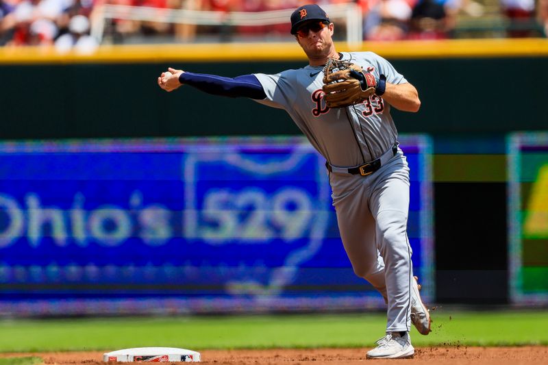 Jul 7, 2024; Cincinnati, Ohio, USA; Detroit Tigers second baseman Colt Keith (33) throws to first to get Cincinnati Reds designated hitter Jonathan India (not pictured) out in the first inning at Great American Ball Park. Mandatory Credit: Katie Stratman-USA TODAY Sports