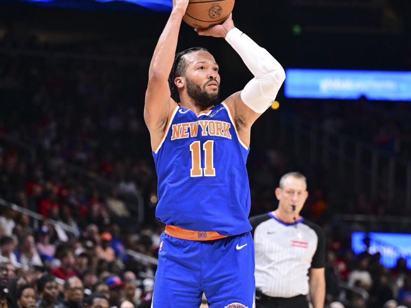 ATLANTA, GA - November 6:  Jalen Brunson #11 of the New York Knicks shoots a three point basket during the game against the Atlanta Hawks on November 6, 2024 at State Farm Arena in Atlanta, Georgia.  NOTE TO USER: User expressly acknowledges and agrees that, by downloading and/or using this Photograph, user is consenting to the terms and conditions of the Getty Images License Agreement. Mandatory Copyright Notice: Copyright 2024 NBAE (Photo by Adam Hagy/NBAE via Getty Images)