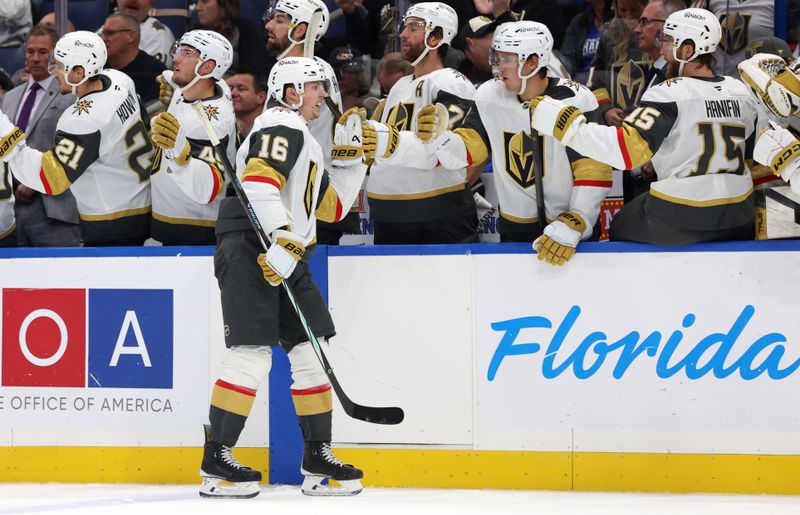 Oct 17, 2024; Tampa, Florida, USA; Vegas Golden Knights left wing Pavel Dorofeyev (16) is congratulated  after he scored a goal against the Tampa Bay Lightning during the first period at Amalie Arena. Mandatory Credit: Kim Klement Neitzel-Imagn Images