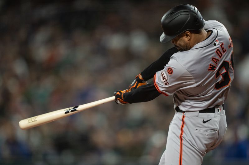 Aug 23, 2024; Seattle, Washington, USA; San Francisco Giants first baseman LaMonte Wade Jr. (31) hits a solo home run during the first inning against the Seattle Mariners at T-Mobile Park. Mandatory Credit: Stephen Brashear-USA TODAY Sports