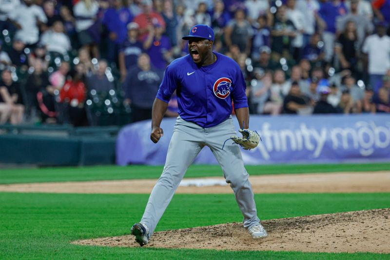 Aug 10, 2024; Chicago, Illinois, USA; Chicago Cubs relief pitcher Hector Neris (51) reacts after delivering a final out against the Chicago White Sox during the ninth inning at Guaranteed Rate Field. Mandatory Credit: Kamil Krzaczynski-USA TODAY Sports