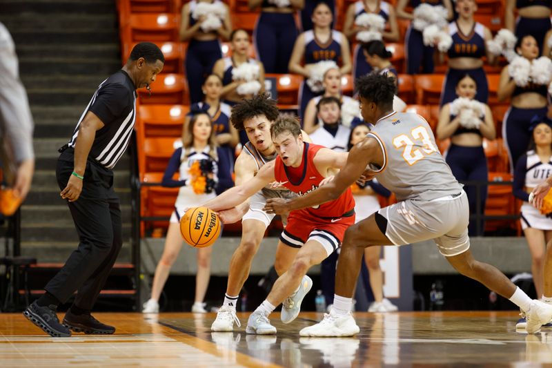 Feb 3, 2024; El Paso, Texas, USA; Liberty University Flames guard Kaden Metheny (3) tries to dribbles through the UTEP Miners defense in the first half at Don Haskins Center. Mandatory Credit: Ivan Pierre Aguirre-USA TODAY Sports