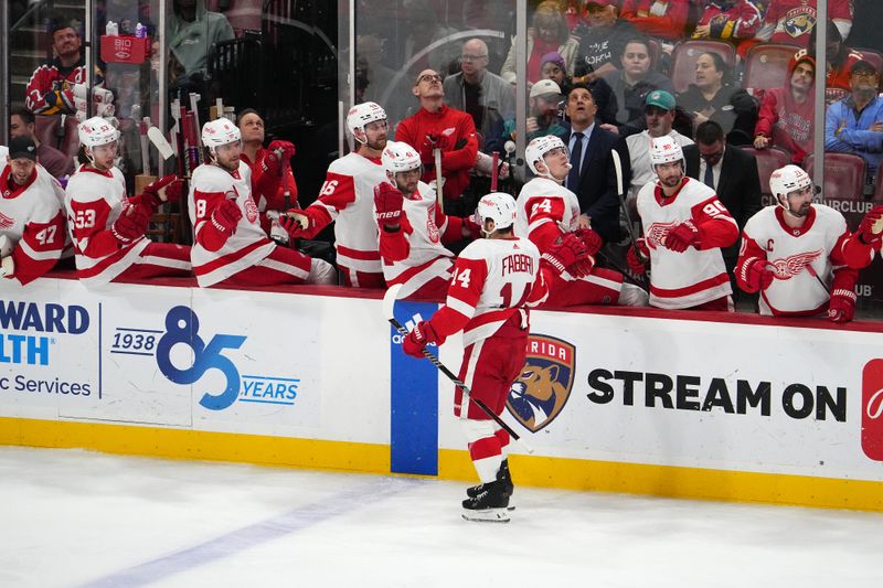 Jan 17, 2024; Sunrise, Florida, USA; Detroit Red Wings center Robby Fabbri (14) celebrates his goal against the Florida Panthers with teammates on the bench during the third period at Amerant Bank Arena. Mandatory Credit: Jasen Vinlove-USA TODAY Sports