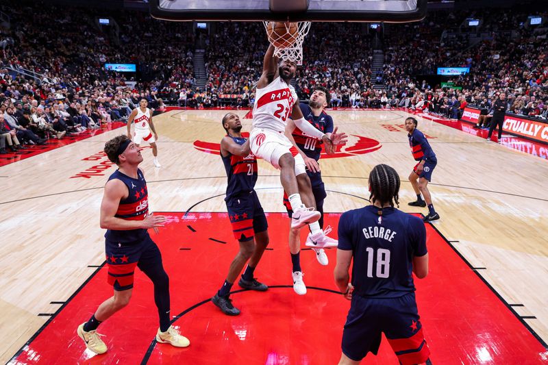 TORONTO, CANADA - MARCH 10: Jamal Shead #23 of the Toronto Raptors dunks the ball during the game against the Washington Wizards on March 10, 2025 at the Scotiabank Arena in Toronto, Ontario, Canada.  NOTE TO USER: User expressly acknowledges and agrees that, by downloading and or using this Photograph, user is consenting to the terms and conditions of the Getty Images License Agreement.  Mandatory Copyright Notice: Copyright 2025 NBAE (Photo by Vaughn Ridley/NBAE via Getty Images)