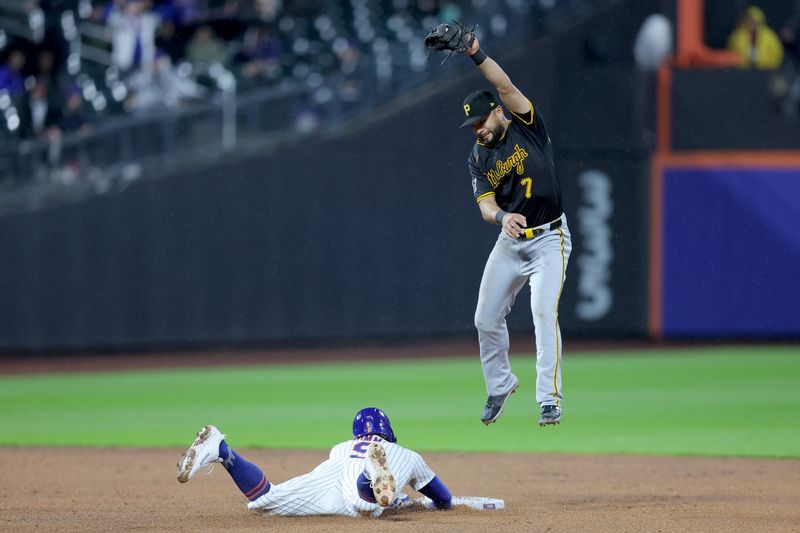 May 14, 2025; New York City, New York, USA; New York Mets left fielder Brandon Nimmo (9) slides safely into second base before Pittsburgh Pirates shortstop Isiah Kiner-Falefa (7) can step on the base on a single by Mets catcher Luis Torrens (not pictured) during the fourth inning at Citi Field. Mandatory Credit: Brad Penner-Imagn Images