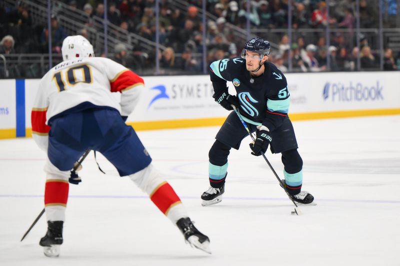 Mar 15, 2026; Seattle, Washington, USA; Seattle Kraken defenseman Ryan Lindgren (55) advances the puck against the Florida Panthers during the third period at Climate Pledge Arena. Mandatory Credit: Steven Bisig-Imagn Images