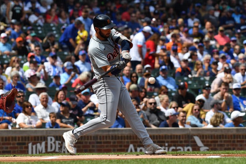 Aug 22, 2024; Chicago, Illinois, USA; Detroit Tigers center fielder Matt Vierling (8) singles during the first inning against the Chicago Cubs at Wrigley Field. Mandatory Credit: Patrick Gorski-USA TODAY Sports