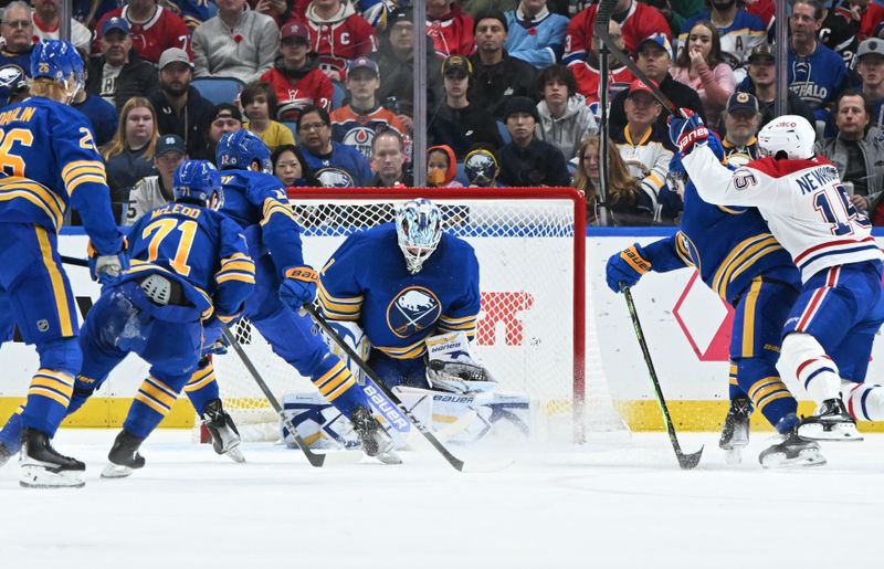 Nov 11, 2024; Buffalo, New York, USA; Buffalo Sabres goaltender Ukko-Pekka Luukkonen (1) blocks a shot by the Montreal Canadiens in the second period at KeyBank Center. Mandatory Credit: Mark Konezny-Imagn Images