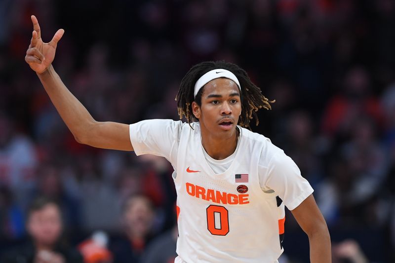 Jan 14, 2023; Syracuse, New York, USA; Syracuse Orange forward Chris Bell (0) reacts to a three-point basket against the Notre Dame Fighting Irish during the second half at the JMA Wireless Dome. Mandatory Credit: Rich Barnes-USA TODAY Sports